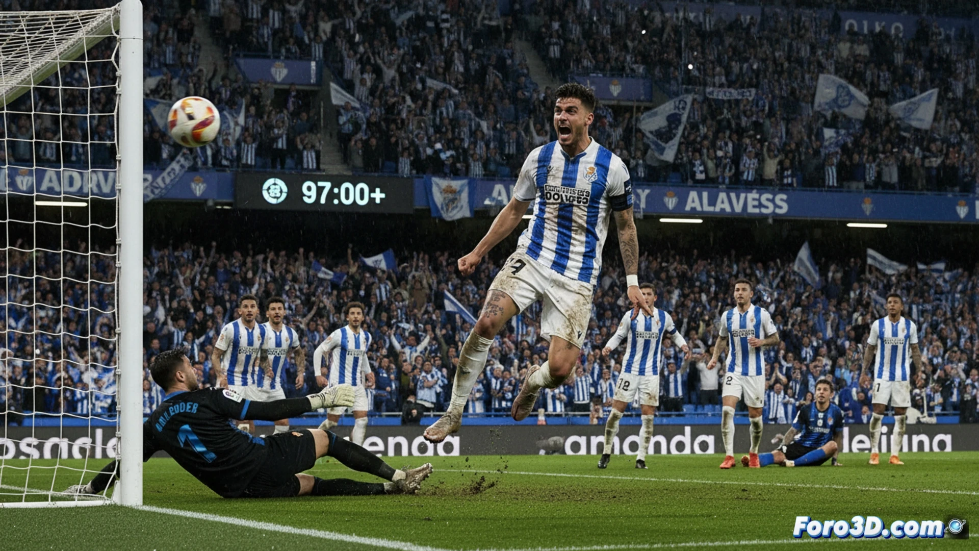 Un jugador del Alavés celebra un gol agónico al fondo de la red en un estadio repleto y en penumbra.