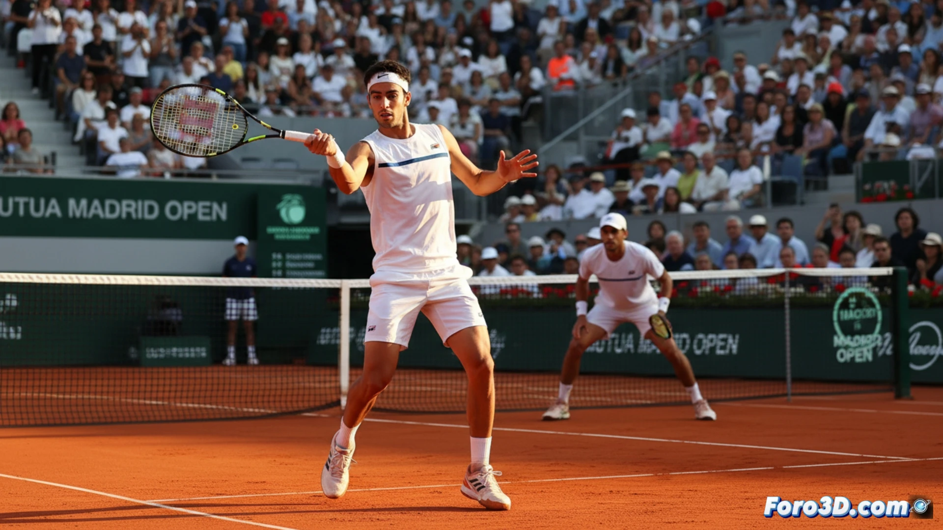 Daniel Mérida celebra su victoria con el puño en alto sobre la tierra batida del Mutua Madrid Open.
