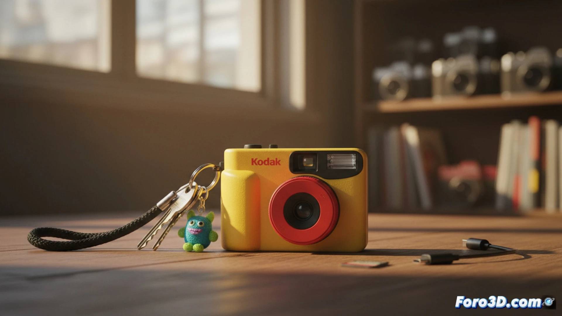 Una cámara digital minimalista con forma de llavero, de cuerpo compacto y diseño que evoca las clásicas desechables.