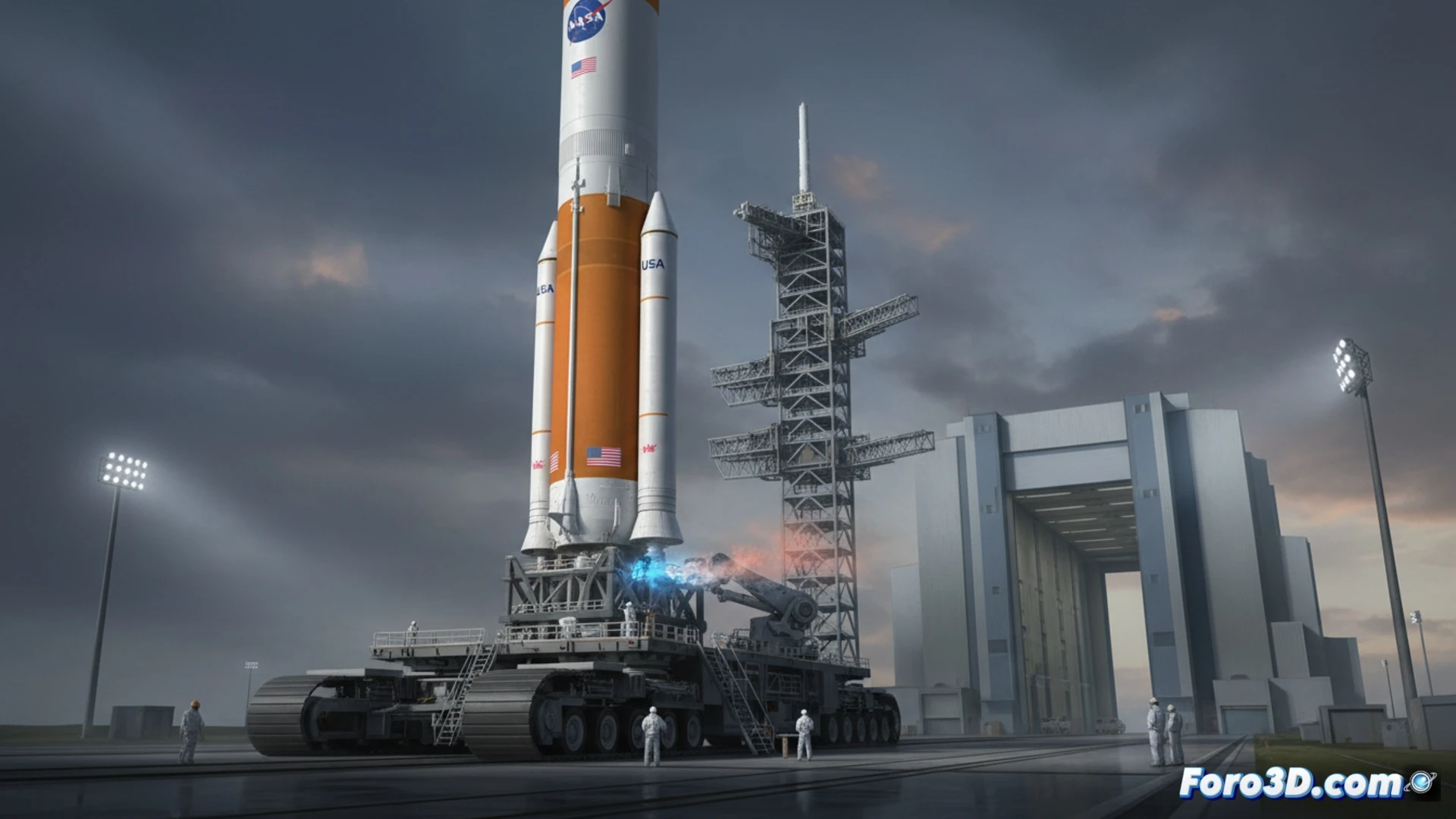 El cohete SLS en la plataforma, con técnicos revisando la etapa criogénica donde se detectó la fuga de helio.