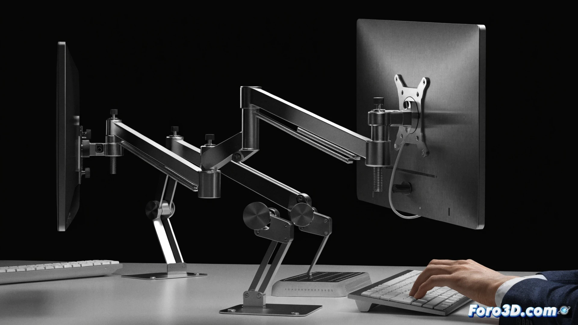 close-up of an adjustable VESA monitor mount being tilted forward by a hand, revealing a dual-arm mechanism and cable management channel, ergonomic office desk with a freed-up workspace, a vertical monitor displaying code and a horizontal monitor showing a CAD model, cinematic engineering visualization, brushed aluminum and matte black metal textures, subtle blue LED glow from the desk edge, clean dramatic lighting highlighting the pivot joint and gas spring, photorealistic technical render, sharp focus on the mounting plate and screw holes