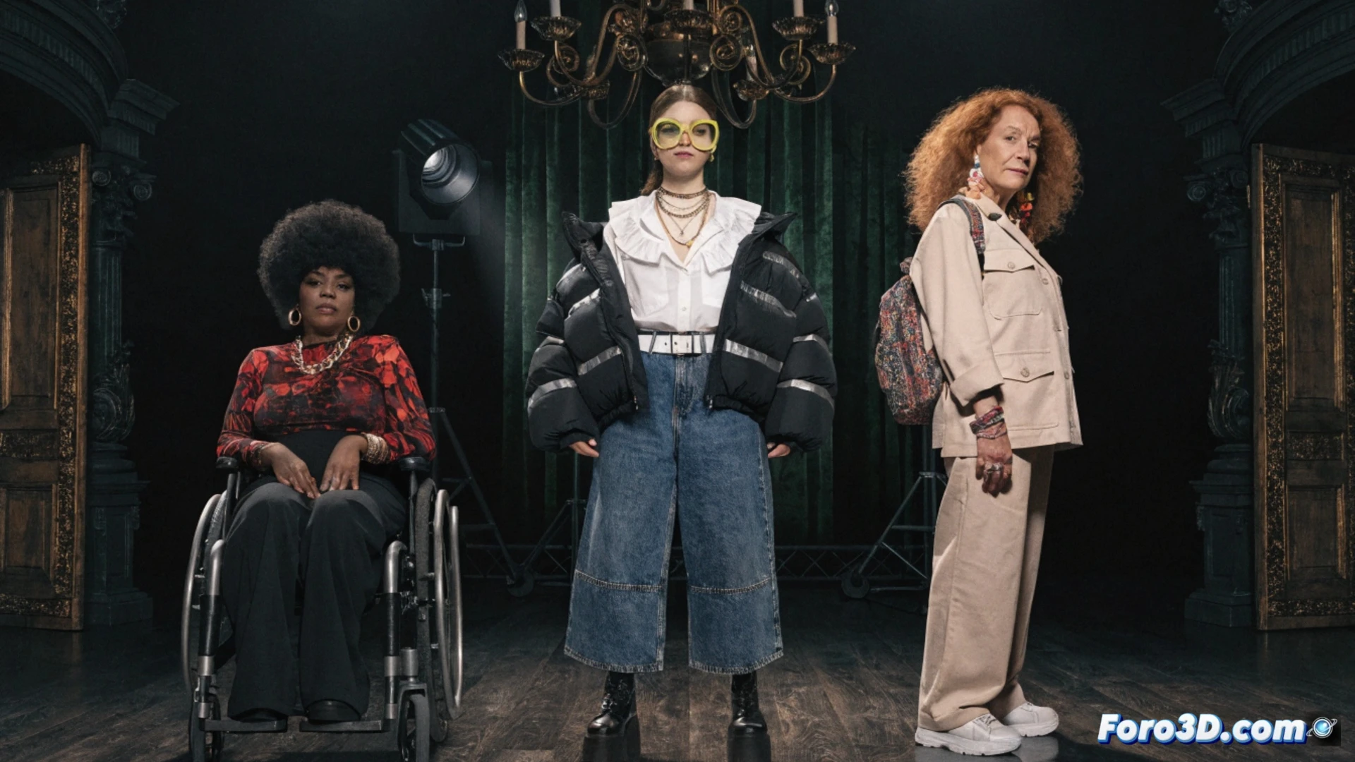 Three actresses on a minimalist theater stage, one using a carbon-fiber racing wheelchair while gesturing dramatically, another adjusting a spotlight beam on her, the third holding a script with visible braille dots, during a rehearsal scene, stage lights casting warm golden and cool blue gels across the set, wheelchair wheels catching motion blur, technical rigging visible overhead with cables and pulleys, photorealistic cinematic style, inclusive performing arts visualization, diverse talent in action, dramatic theatrical lighting, ultra-detailed textures on wheelchair frame and fabric costumes