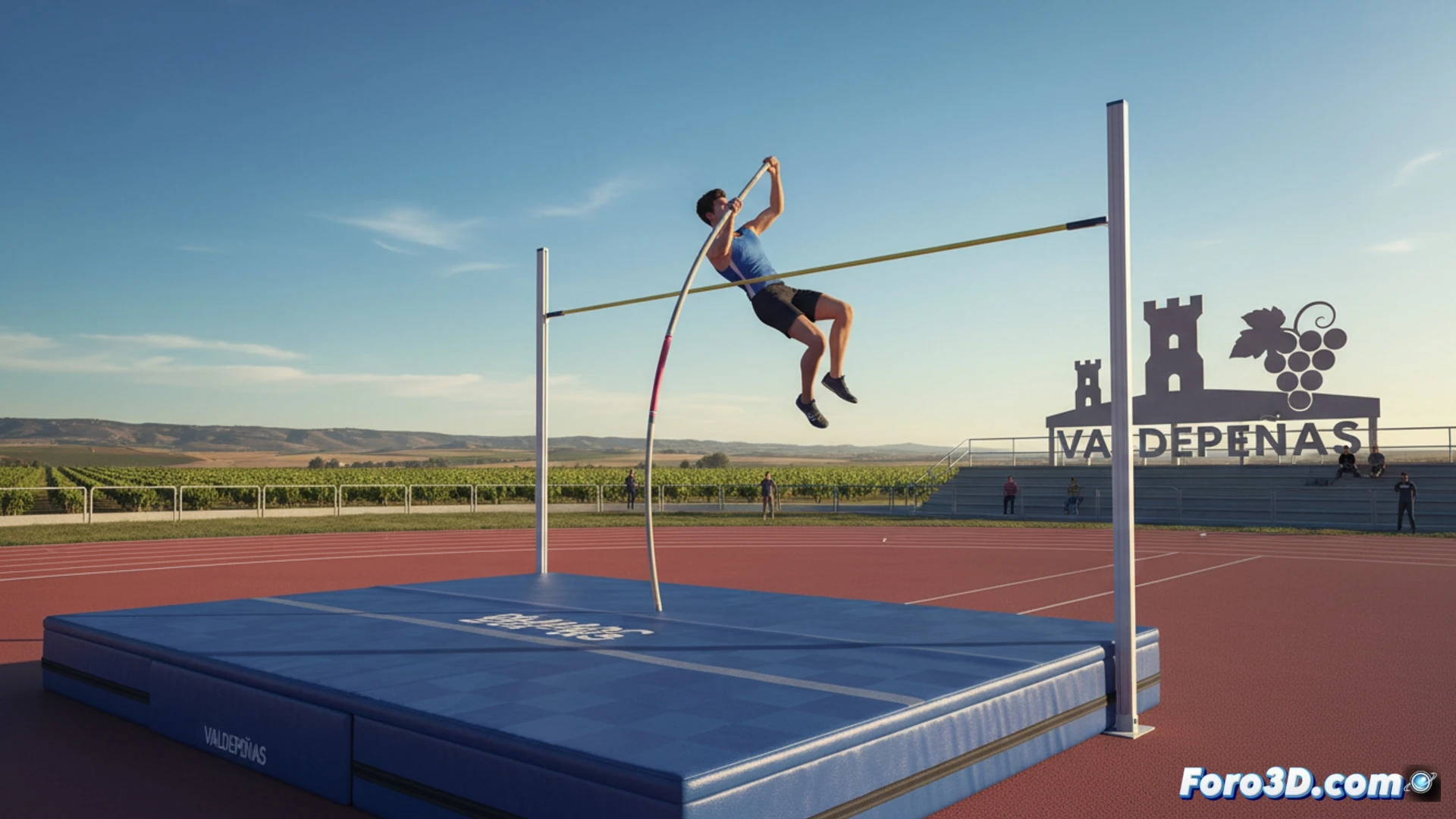 Atleta en salto con pértiga sobre foso, en pista de atletismo de Valdepeñas, al atardecer.